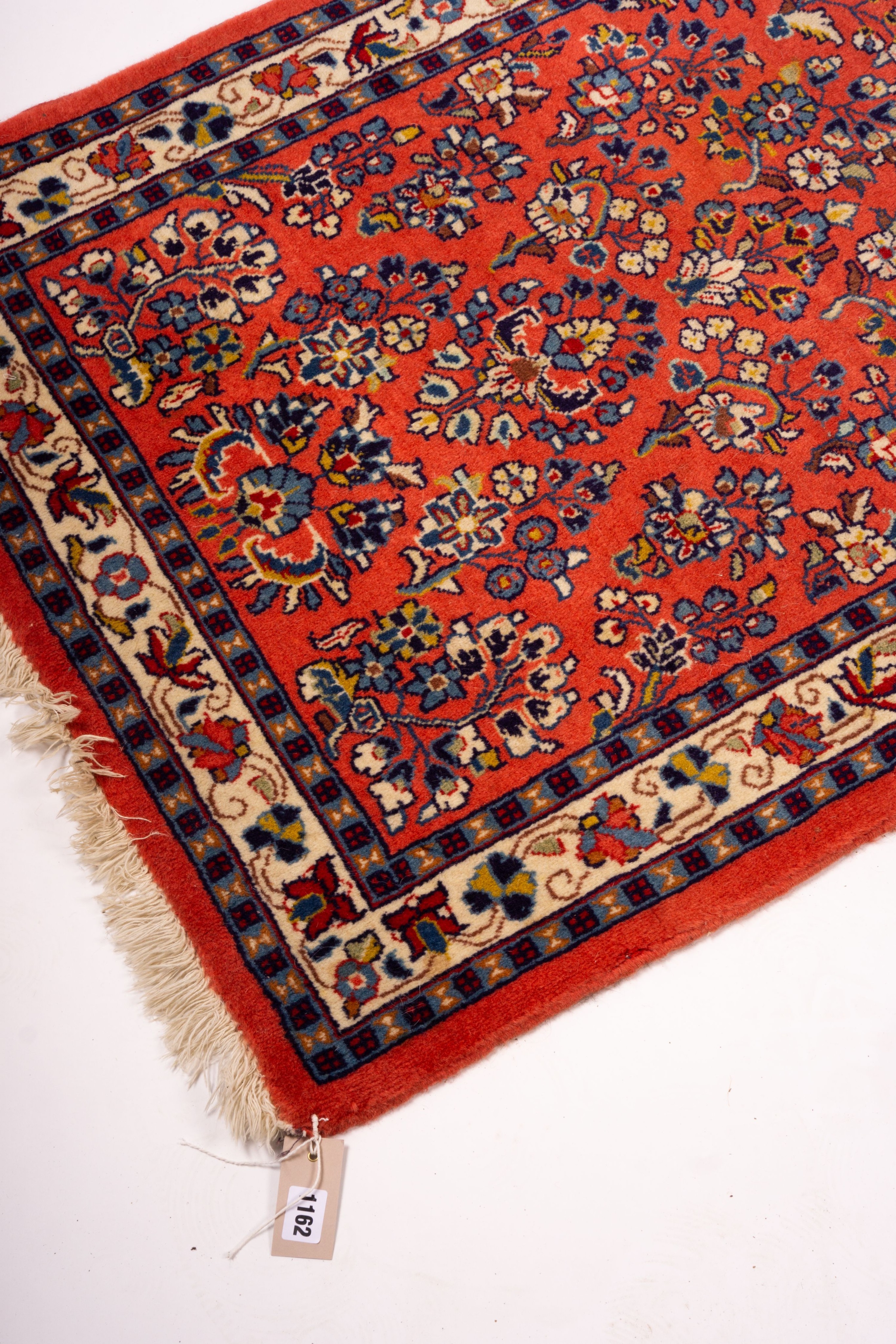 A Persian red ground runner, 202 x 83cm